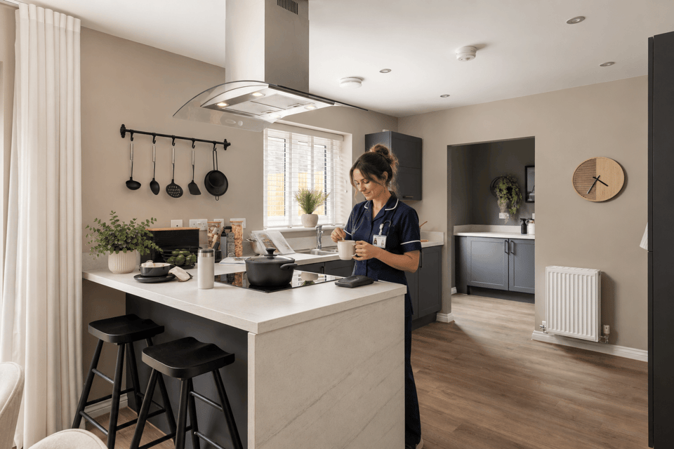 Nurse stood in kitchen
