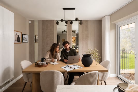 Young couple sat round table