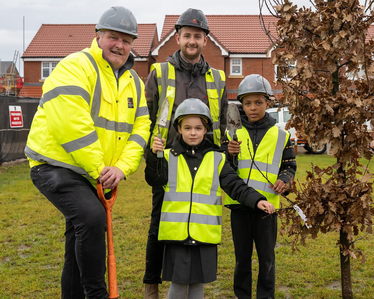 Three down, one thousand to go: school pupils help plant first trees at local development